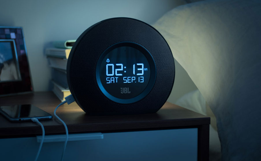 Multi-sensory alarm clock with LED ambient light